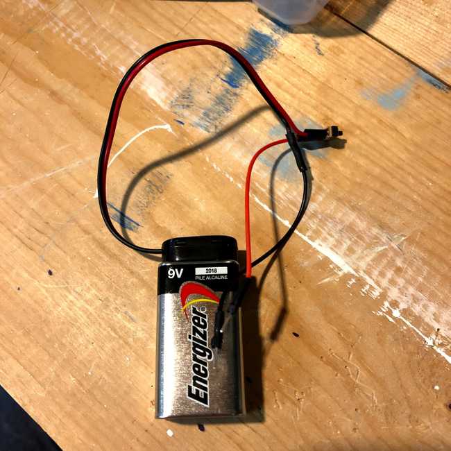 image of a nine volt battery with a on off switch added